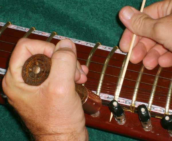 Mounting a esraj sympathetic string 