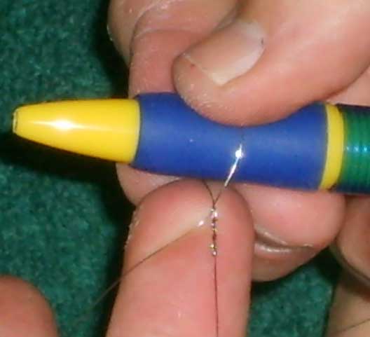Mounting a esraj string (step 3)